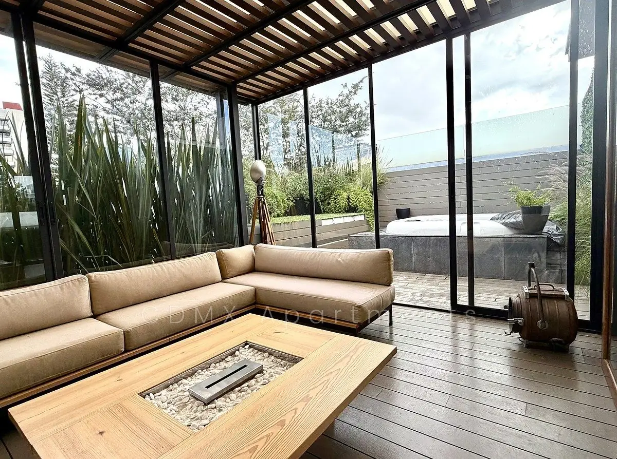 Glass-walled terrace lounge beside the private jacuzzi